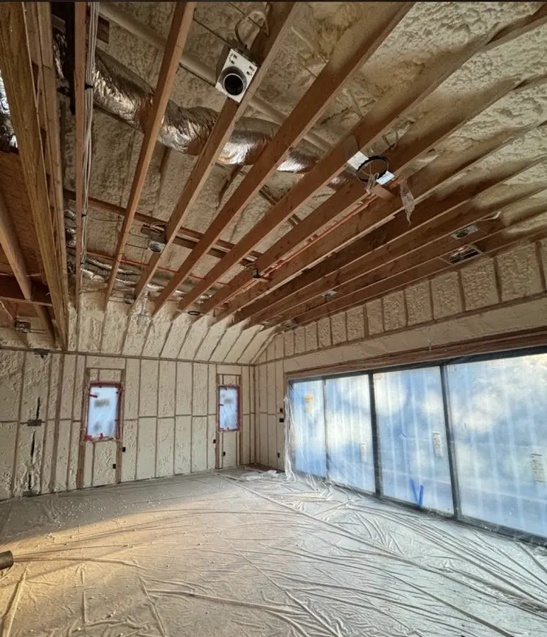 Interior walls and ceiling insulated with spray foam during new construction in Fairview Park